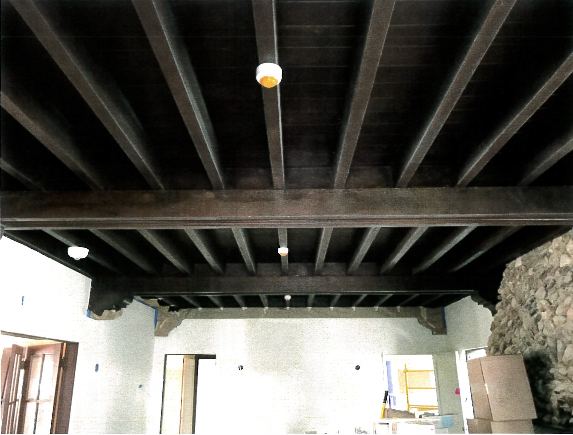 Exposed beam ceiling in main level salon 